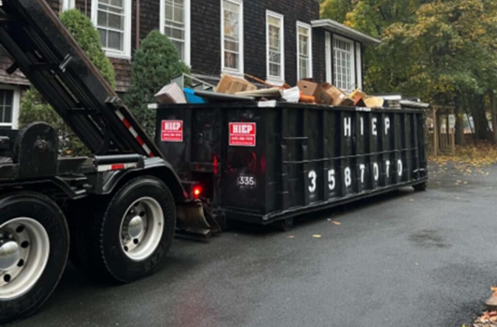 A variety of Hiep Sanitation dumpsters lined up, showcasing different sizes available for commercial use in Westchester County, NY, ideal for local businesses seeking reliable waste disposal solutions.