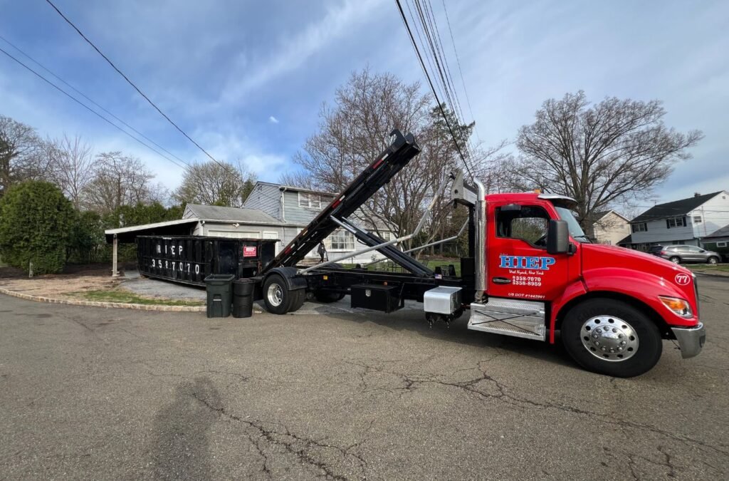 A Hiep Sanitation staff member assisting with dumpster logistics on a construction site in Clarkstown, NY to demonstrate smooth coordination. Construction Dumpster Rental near me.