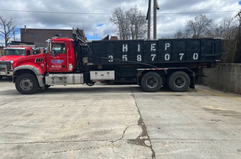 A Hiep Sanitation team member managing dumpster rental in Newburgh, NY, ensuring safety, reliability, and eco-friendly service. Dumpster Rental near me.